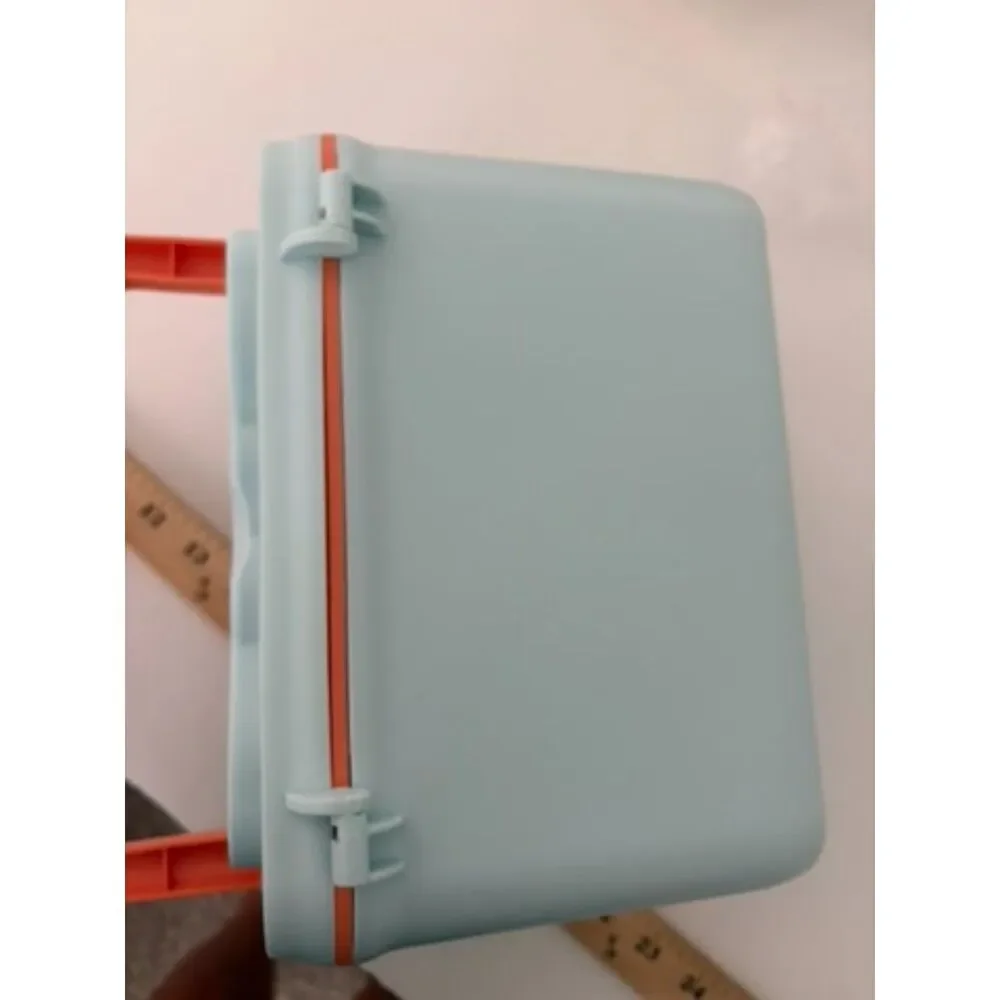 Modern portable plastic medicine box with orange handle and latch